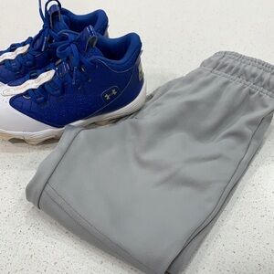 Boys Under Armour cleats size 1.5 and youth small baseball pants